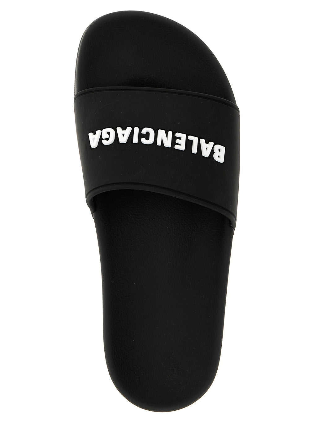 Sandales en plastique bicolores Balenciaga, style moderne et confortable, visibles en premier plan.