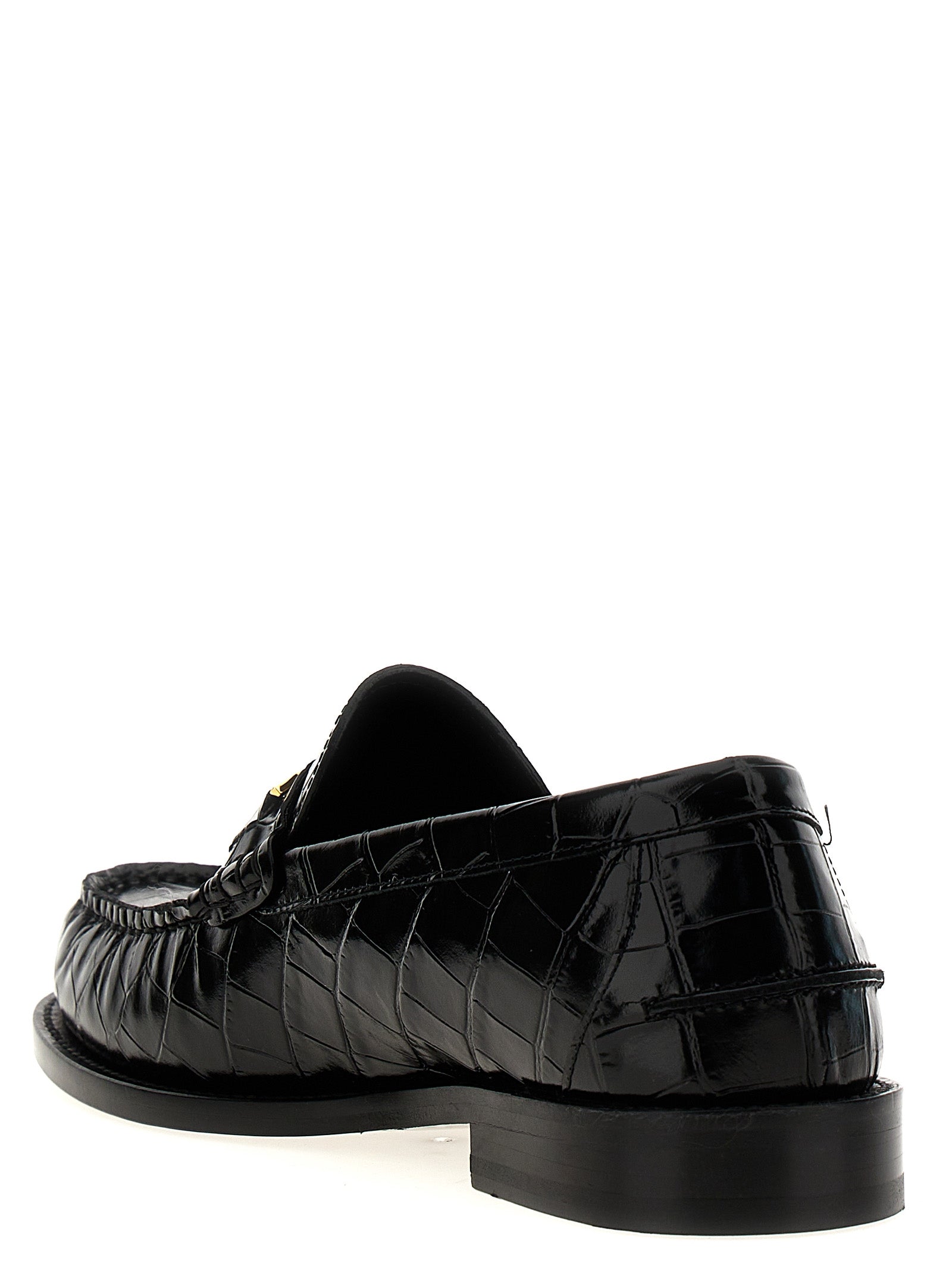 Chaussures mocassins en velours noir en cuir de Versace, style slip-on, élégantes et sophistiquées.