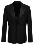 Blazer noir en laine Givenchy, coupe élégante, détails sophistiqués, porté sur un mannequin.
