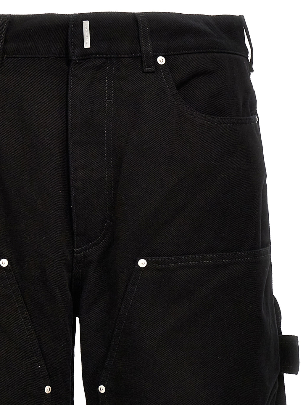 Jeans en denim noir en coton de la marque Givenchy, coupe classique, visible en détail sur l'image.