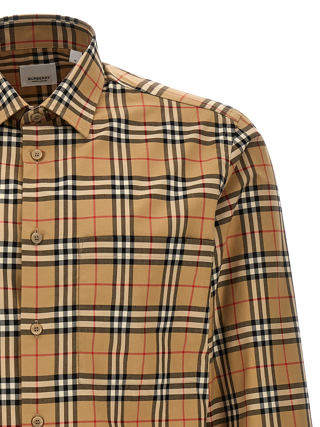 Blouse en coton beige de la marque Burberry, coupe classique et détails élégants visibles sur l'image.