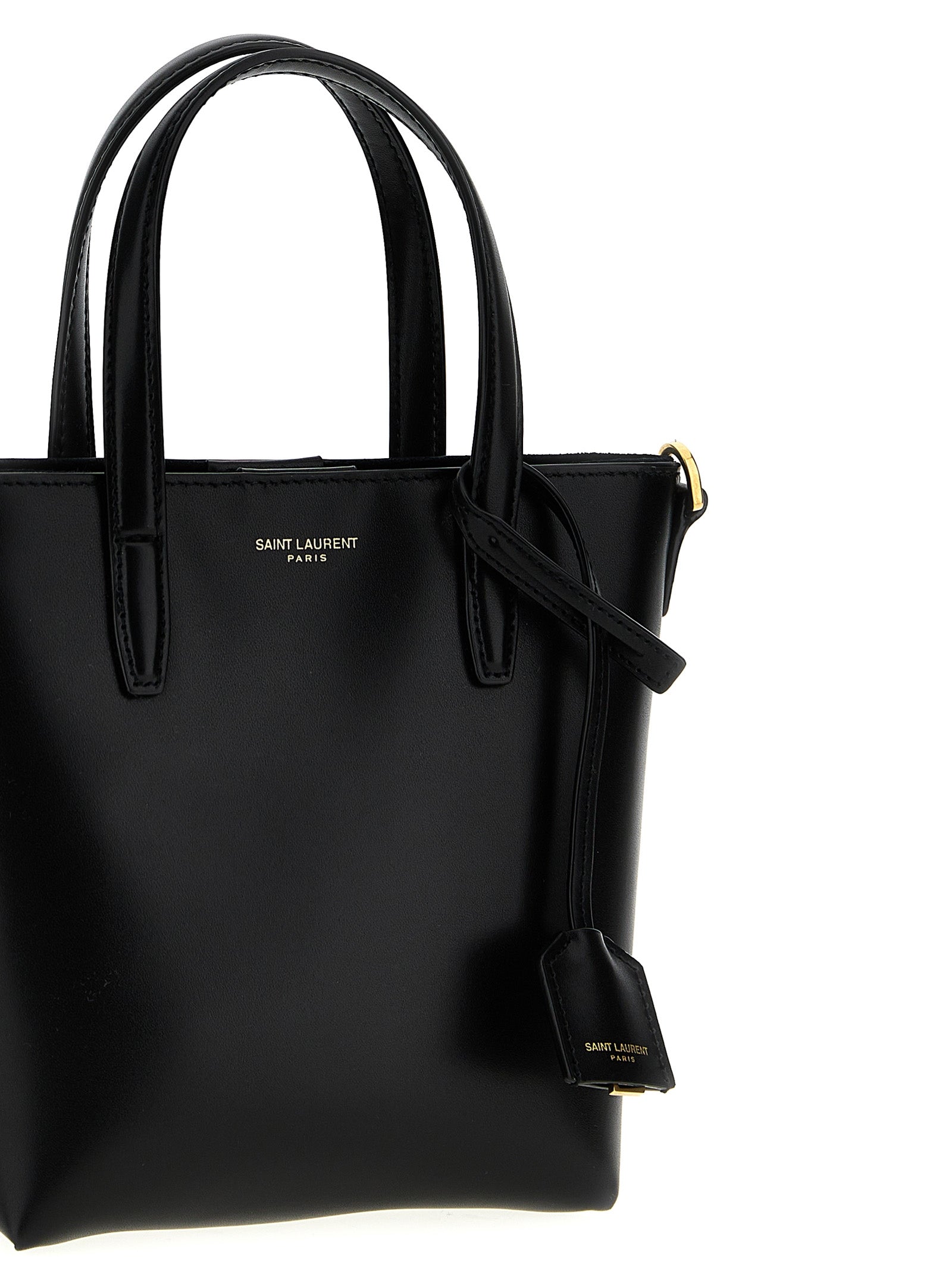 Sac à main Saint Laurent en cuir de veau noir, grand modèle tote avec poignées épaisses et logo discret sur le devant.