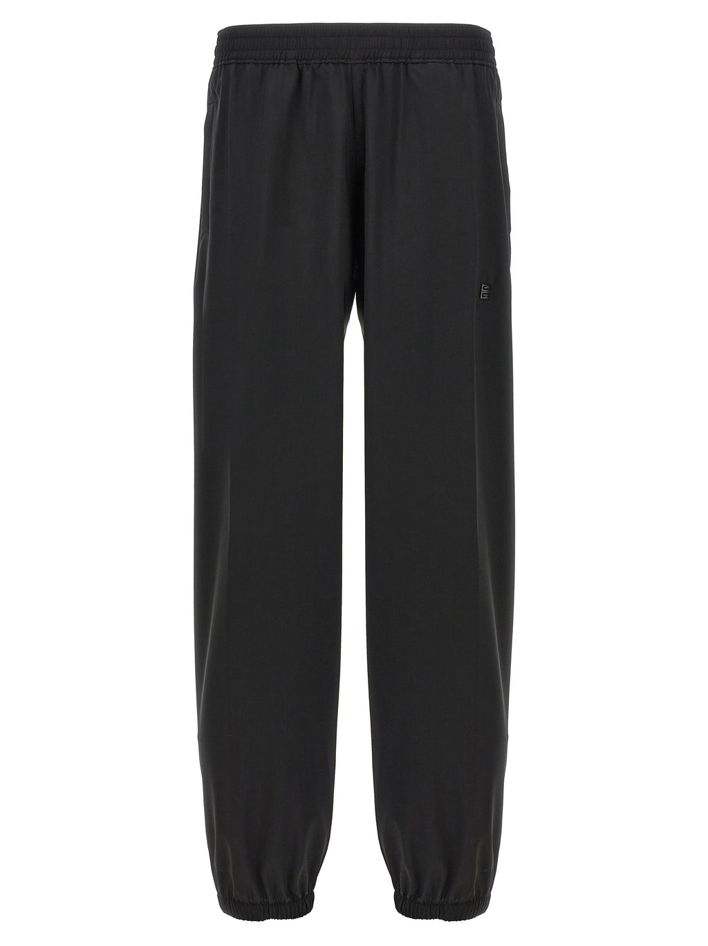 Pantalons décontractés en laine vierge noire de Givenchy, coupe élégante et moderne, visibles sur un mannequin.