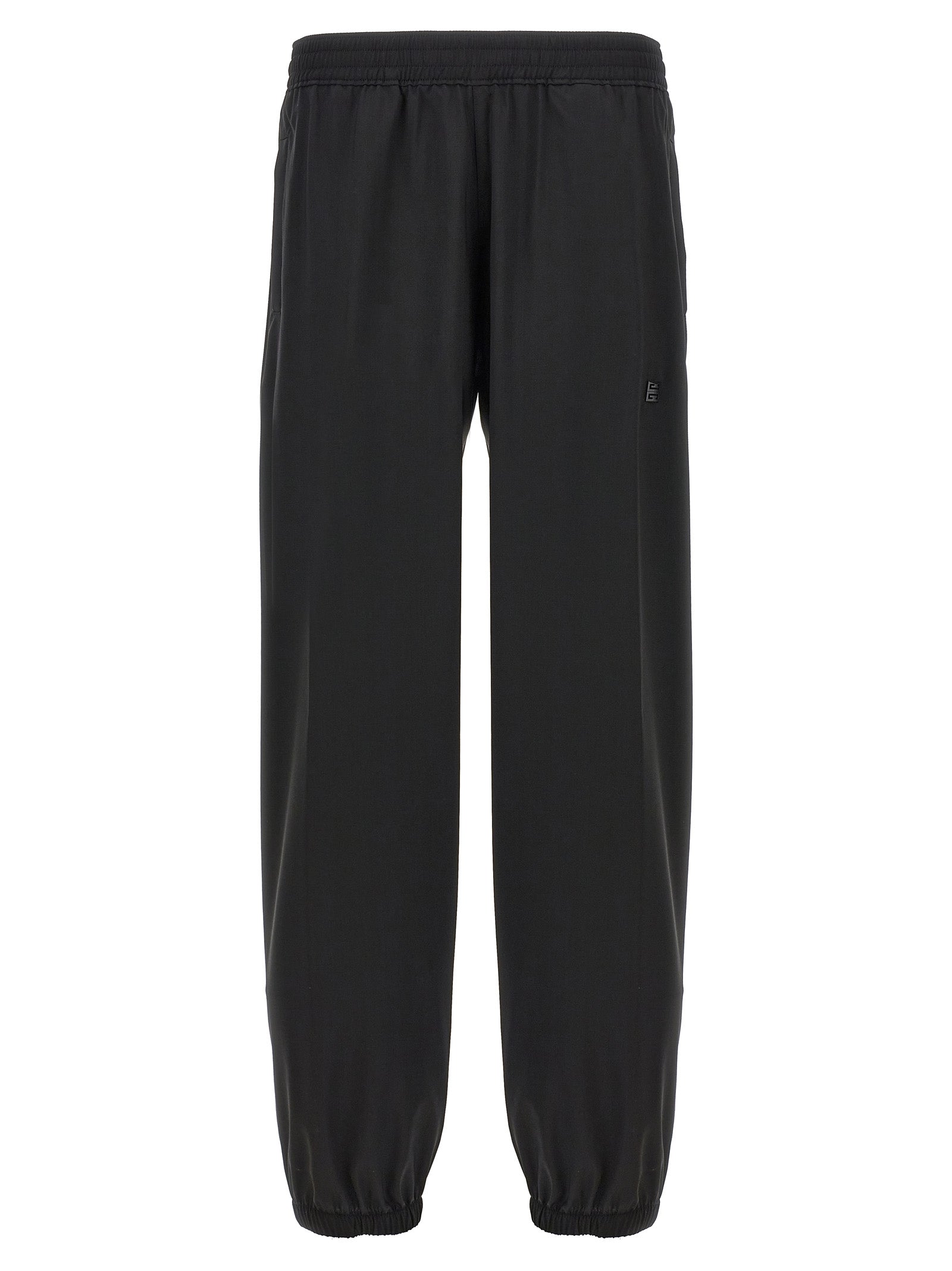 Pantalons décontractés en laine vierge noire de Givenchy, coupe élégante et moderne, visibles sur un mannequin.