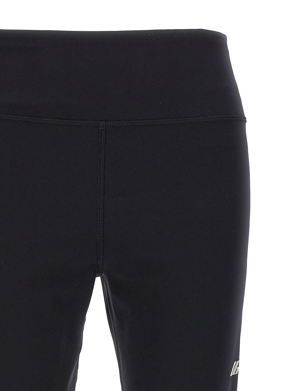 Leggings noires en polyamide de Balenciaga, ajustés et élégants, montrant la texture lisse du tissu.