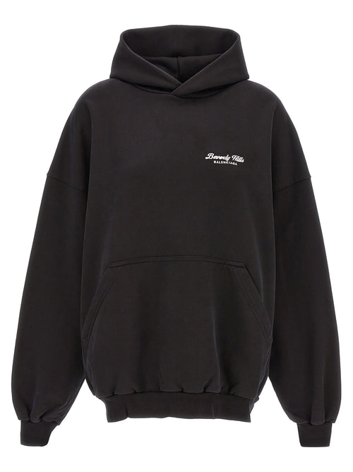 Sweat à capuche en coton bicolore de Balenciaga, style moderne avec logo visible, tissu doux et confortable.