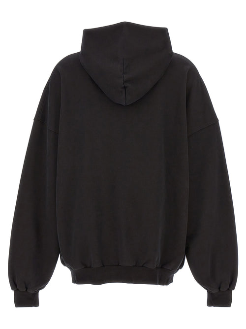 Sweat à capuche en coton bicolore de Balenciaga, gris et noir, avec logo Balenciaga visible sur la poitrine.