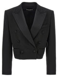 Veste blazer noire en laine vierge de Dolce & Gabbana, coupe élégante et moderne, portée sur un fond neutre.