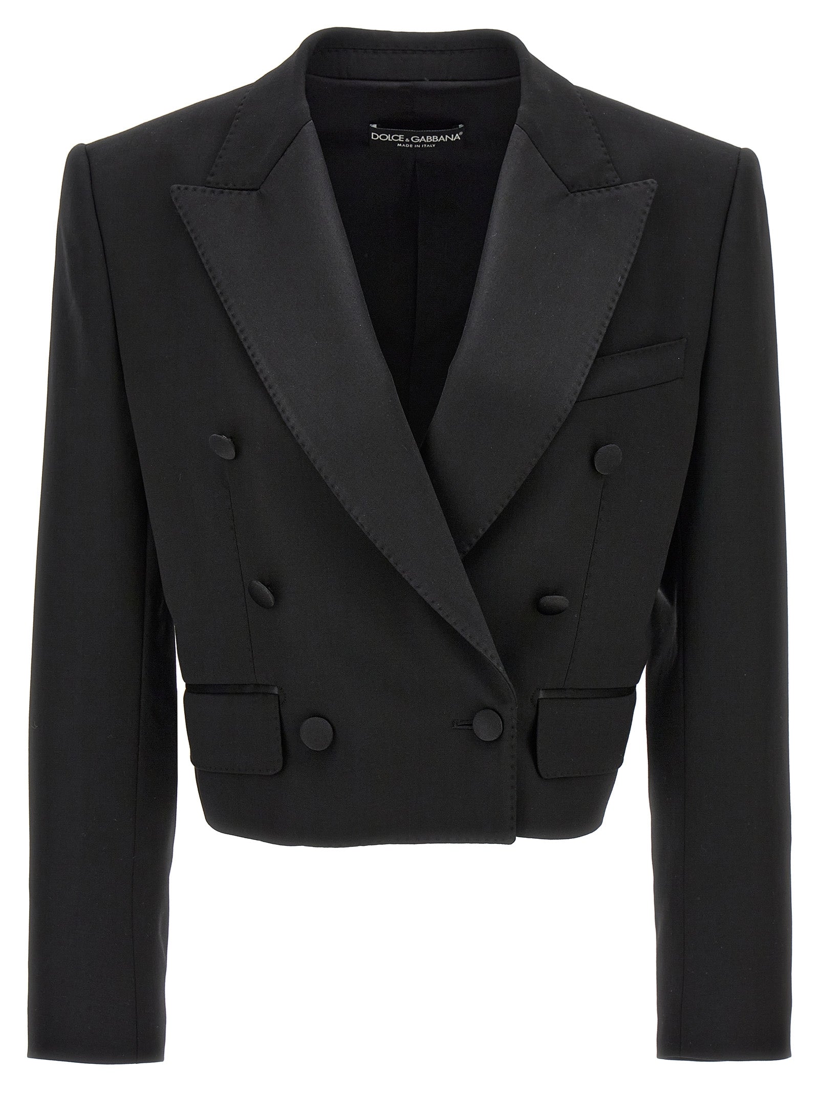 Veste blazer noire en laine vierge de Dolce & Gabbana, coupe élégante et moderne, portée sur un fond neutre.