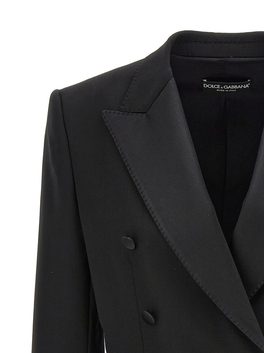 Blazer noir en laine vierge de Dolce & Gabbana, veste élégante pour homme ou femme, boutonnière et coupe ajustée visible.
