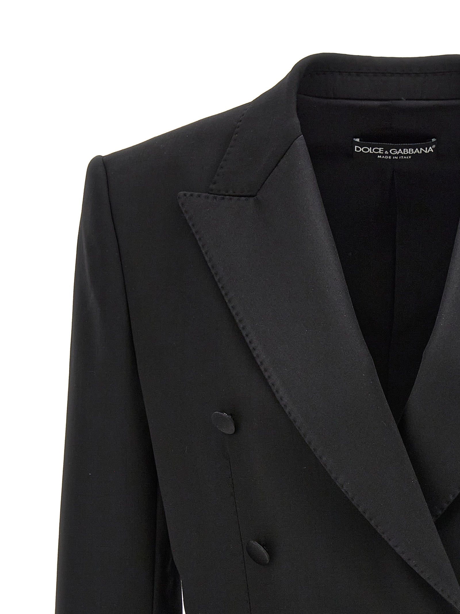 Blazer noir en laine vierge de Dolce & Gabbana, veste élégante pour homme ou femme, boutonnière et coupe ajustée visible.