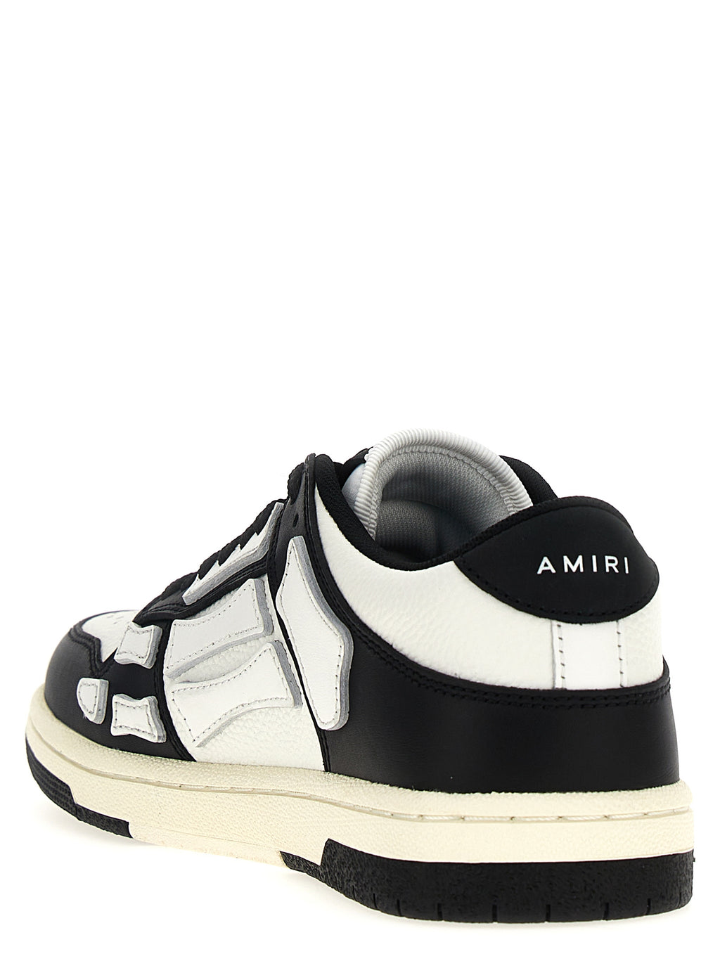 Chaussures basses en cuir bicolore Amiri, sneakers low top avec design moderne et détails raffinés.