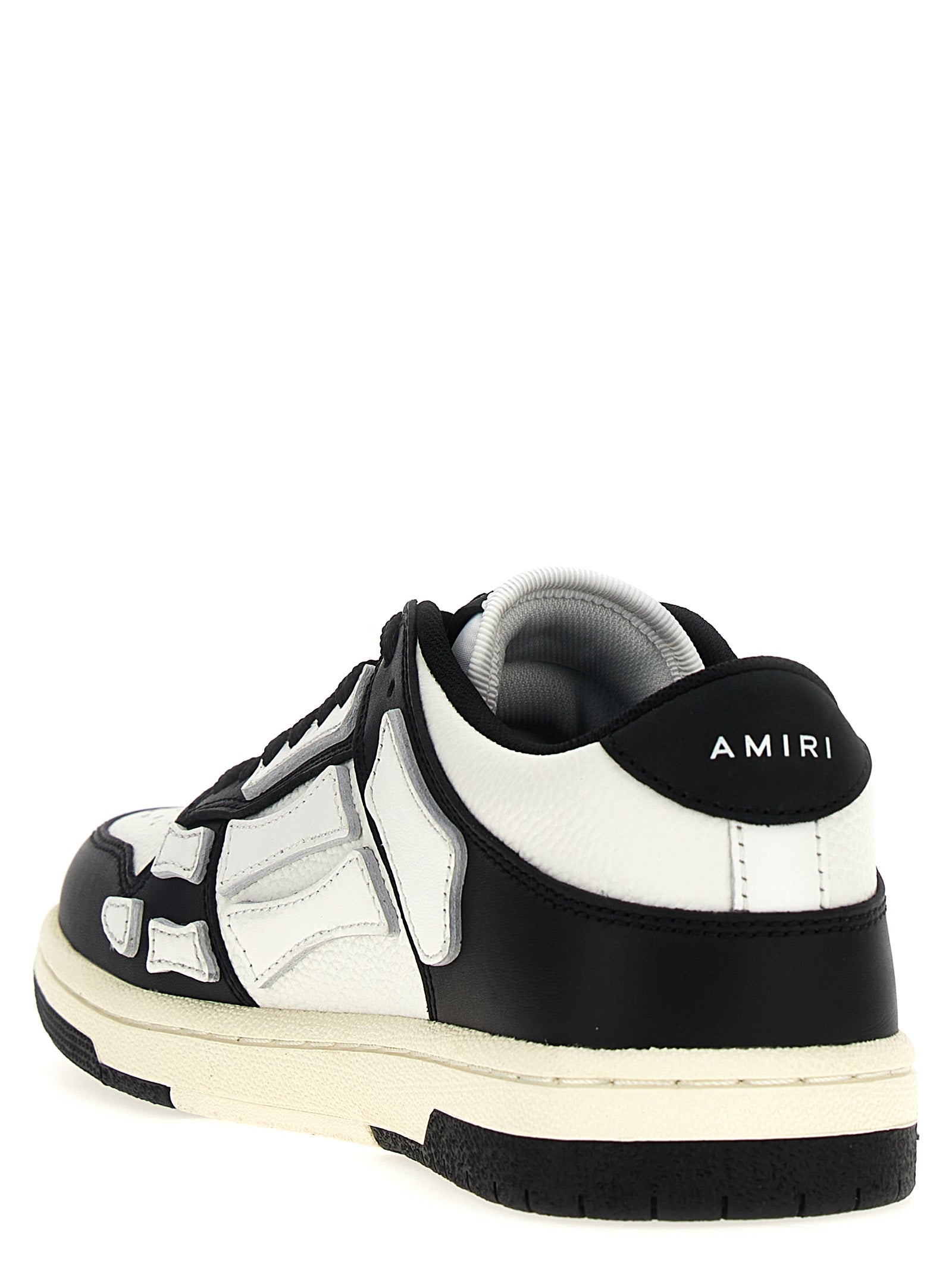Chaussures basses en cuir bicolore Amiri, sneakers low top avec design moderne et détails raffinés.