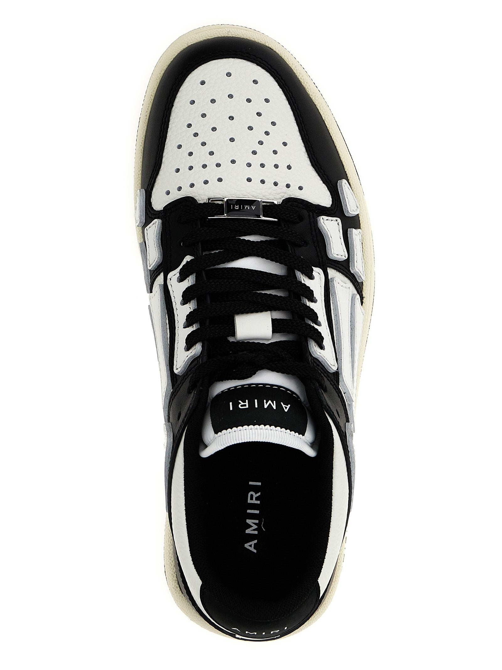 Chaussures basses en cuir bicolore Amiri, sneakers low top élégants avec design moderne et détails en cuir.