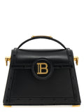 Sac à main en cuir de veau noir Balmain, élégant et sophistiqué, avec détails de luxe visibles sur l'image.