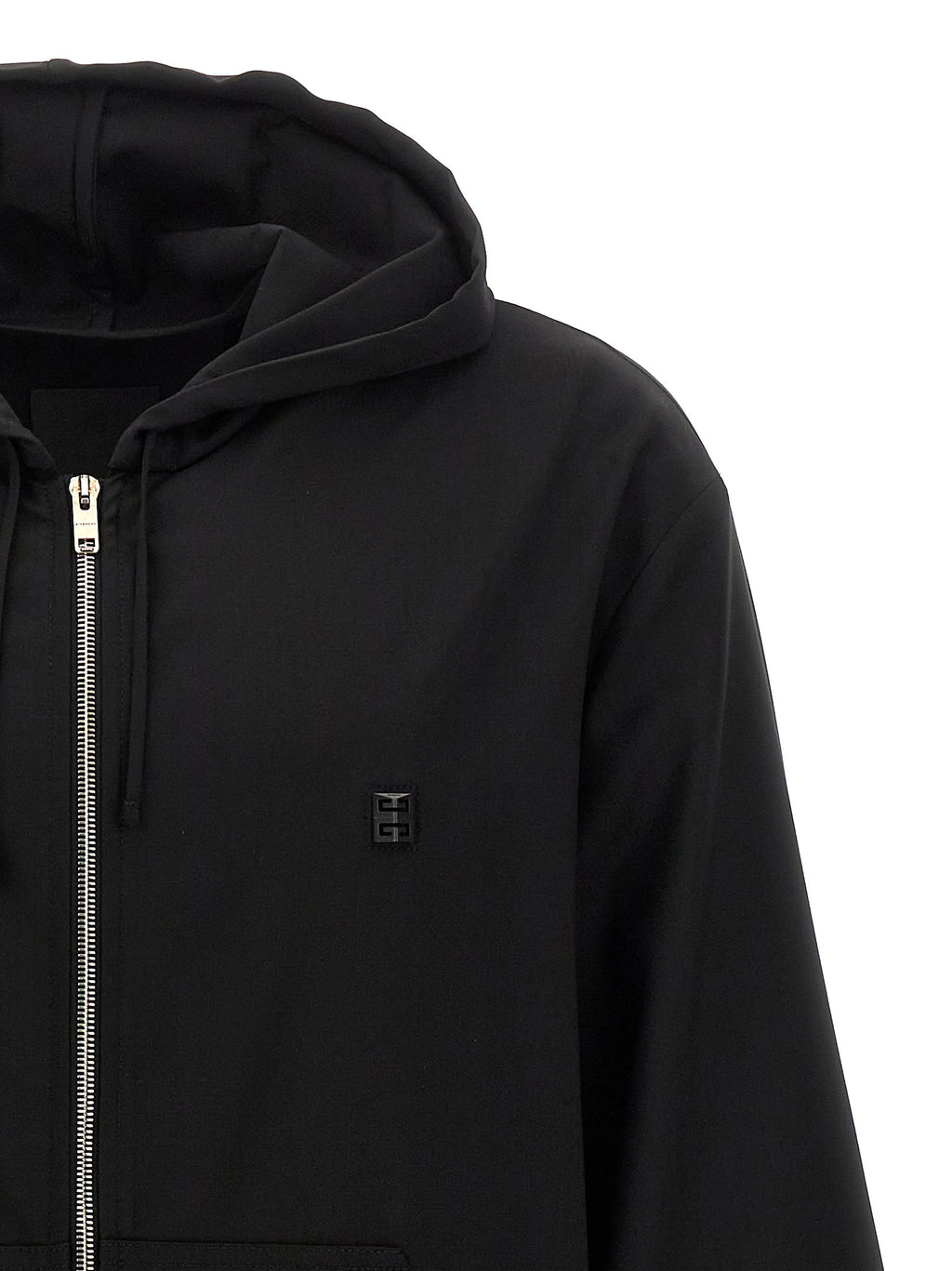 Sweatshirt Givenchy en laine vierge noire, coupe décontractée, avec logo discret, porté sur un mannequin.