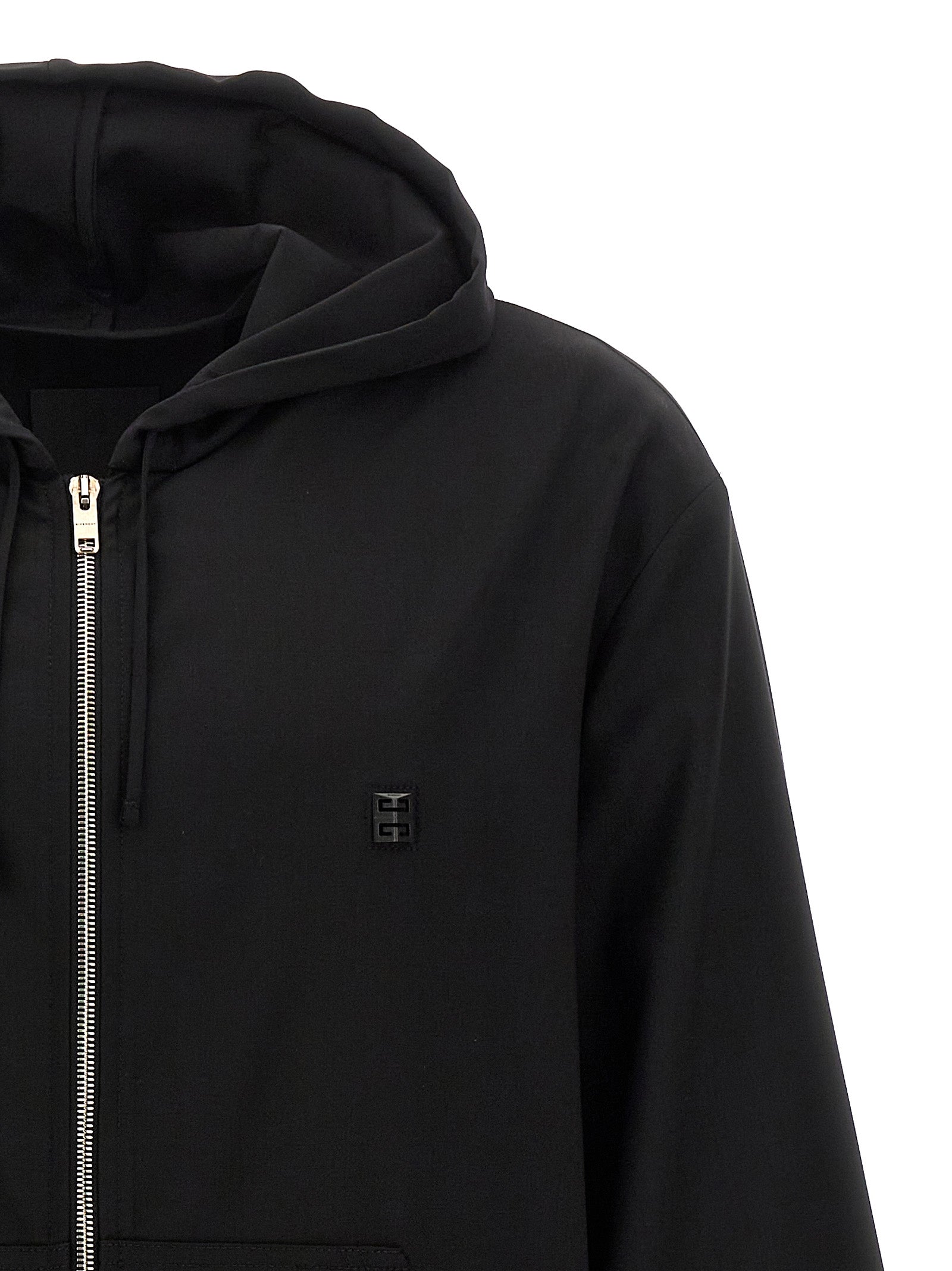 Sweatshirt Givenchy en laine vierge noire, coupe décontractée, avec logo discret, porté sur un mannequin.