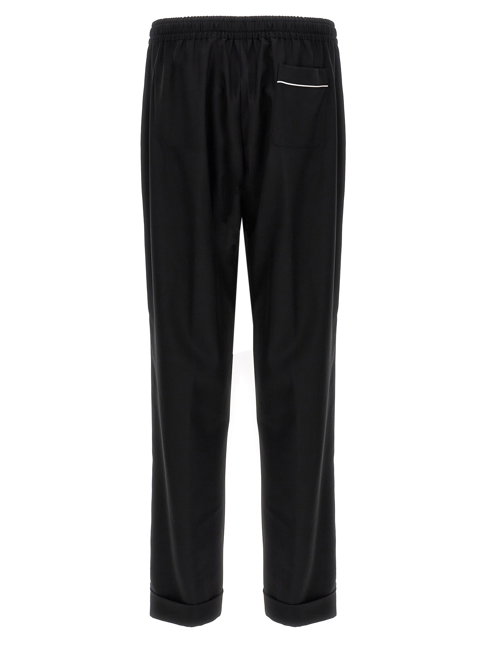 Pantalons décontractés en laine vierge noire de Dolce & Gabbana, style élégant et confortable pour un look chic.