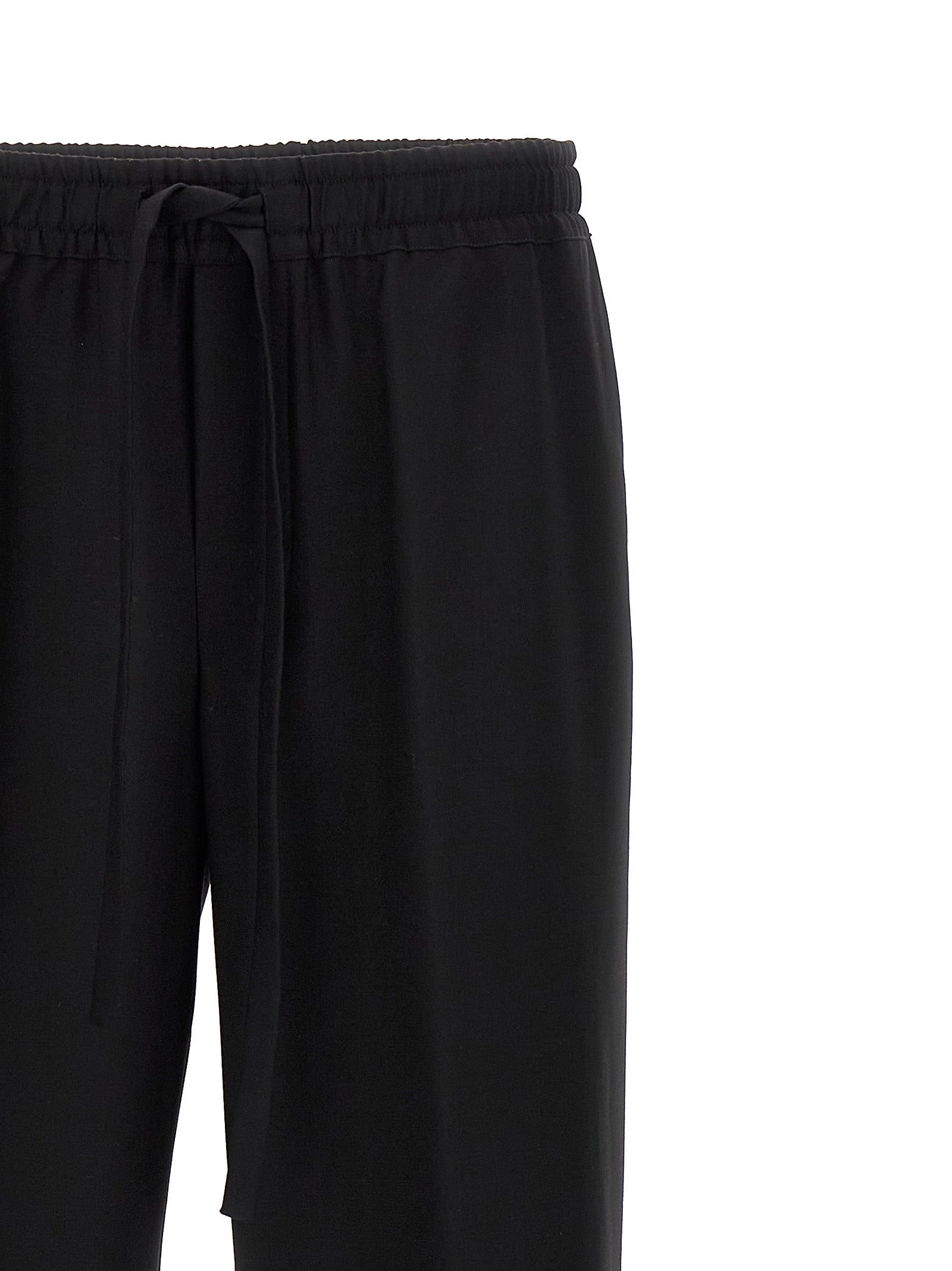 Pantalons décontractés en laine vierge noire de Dolce & Gabbana, style élégant et confortable pour homme.