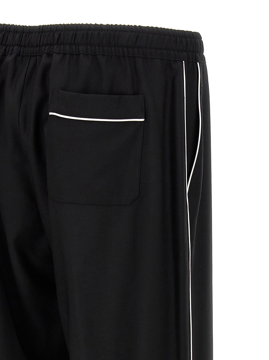 Pantalon décontracté en laine vierge noire de Dolce & Gabbana, style élégant et confortable pour homme.