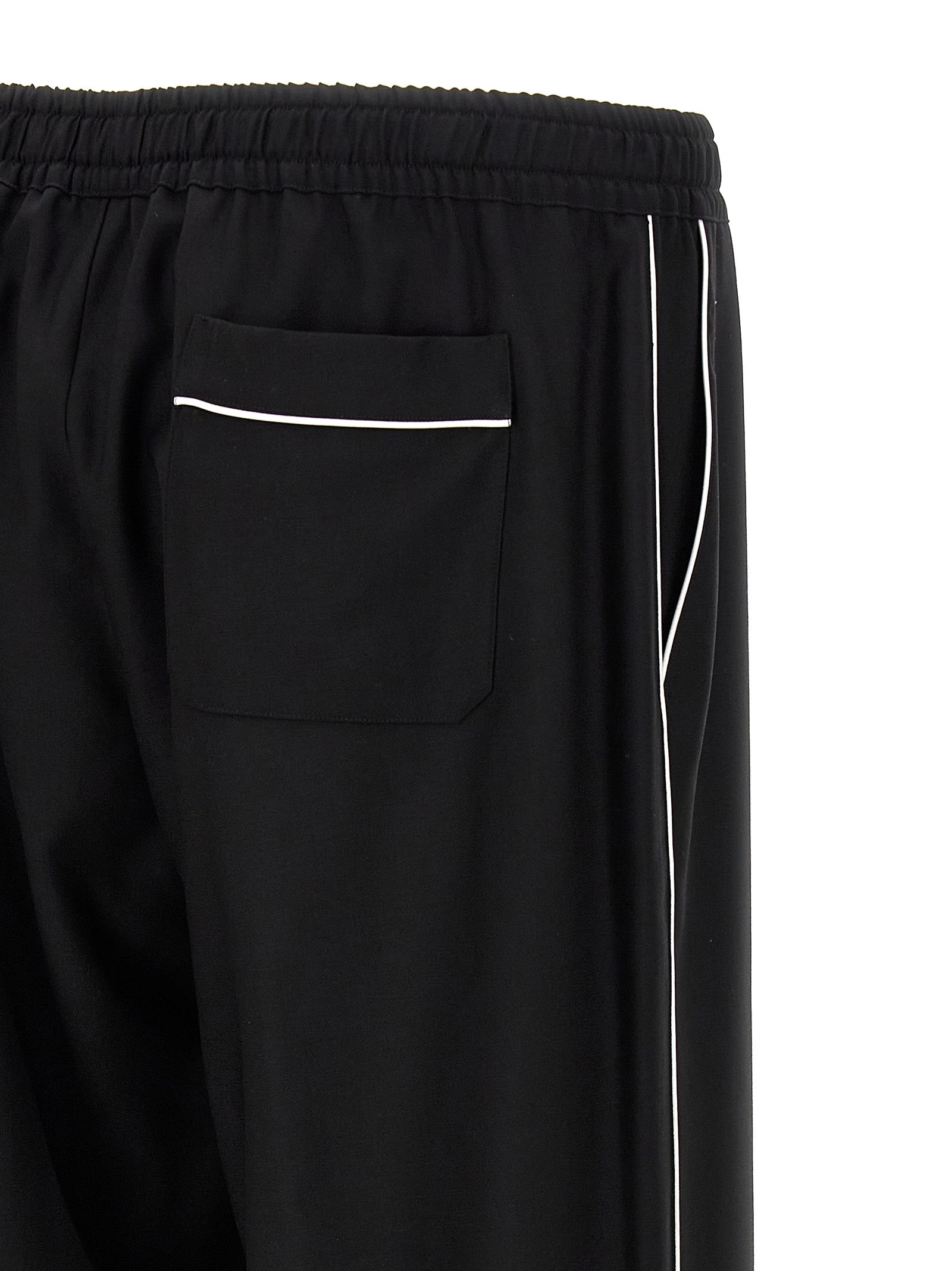 Pantalon décontracté en laine vierge noire de Dolce & Gabbana, style élégant et confortable pour homme.
