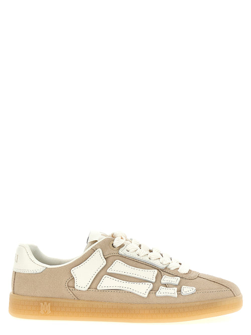 Chaussures sneakers beige en peau de vache Amiri, vue de face, avec détails de style et finition en cuir.