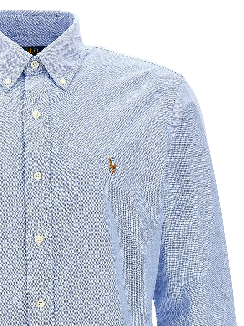 Chemise en coton bleue Polo Ralph Lauren, style classique avec col et boutons, sur un fond neutre.