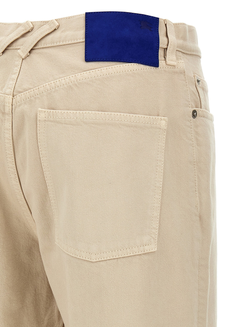 Pantalon beige en coton décontracté de Burberry, coupe classique et style élégant pour un look confortable.