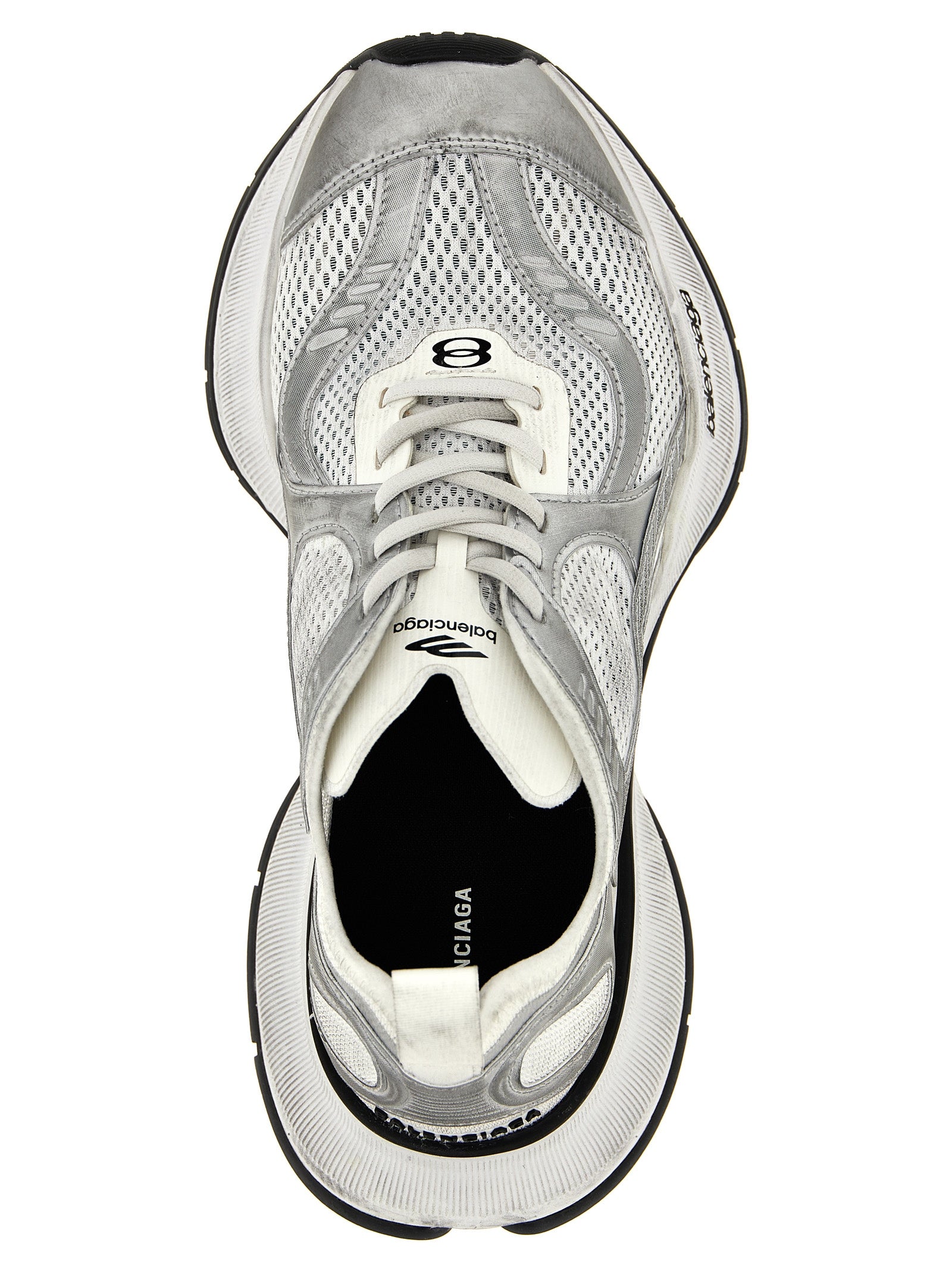 Sneakers athlétiques gris en polyester de la marque Balenciaga, vue de face, avec semelle blanche et design moderne.