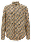 Chemise en coton beige Burberry, style élégant, boutons visibles et col classique, tissu léger et raffiné.