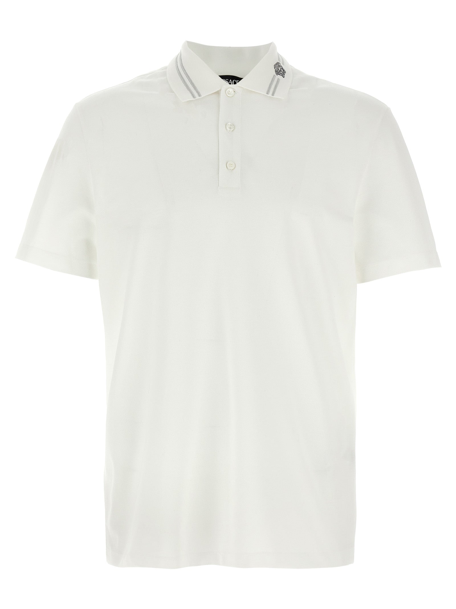 Chemise polo blanche en coton Versace, vue de face, avec logo emblématique sur la poitrine.