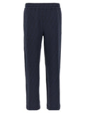 Pantalons de jogging en polyester bleu de la marque Fendi, vêtements de sport confortables avec logo Fendi visible.