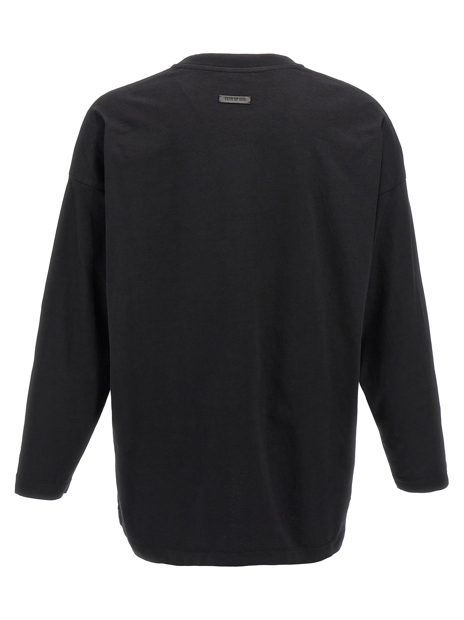 T-shirt en coton noir de la marque Fear Of God, coupe classique et logo discret, porté sur un mannequin.