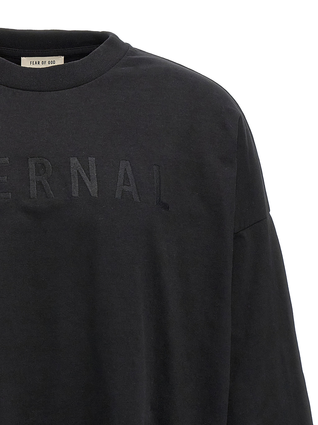 T-shirt en coton noir Fear Of God, coupe décontractée et logo discret visible sur le devant.
