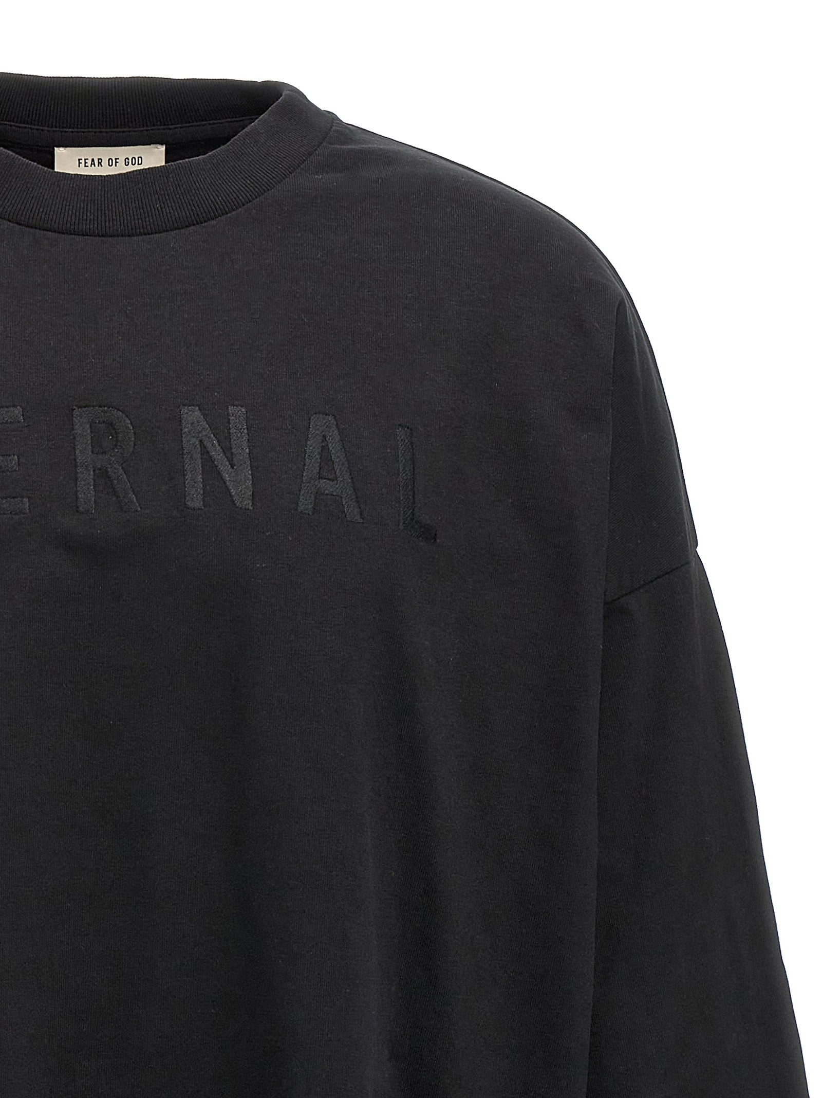 T-shirt en coton noir Fear Of God, coupe décontractée et logo discret visible sur le devant.