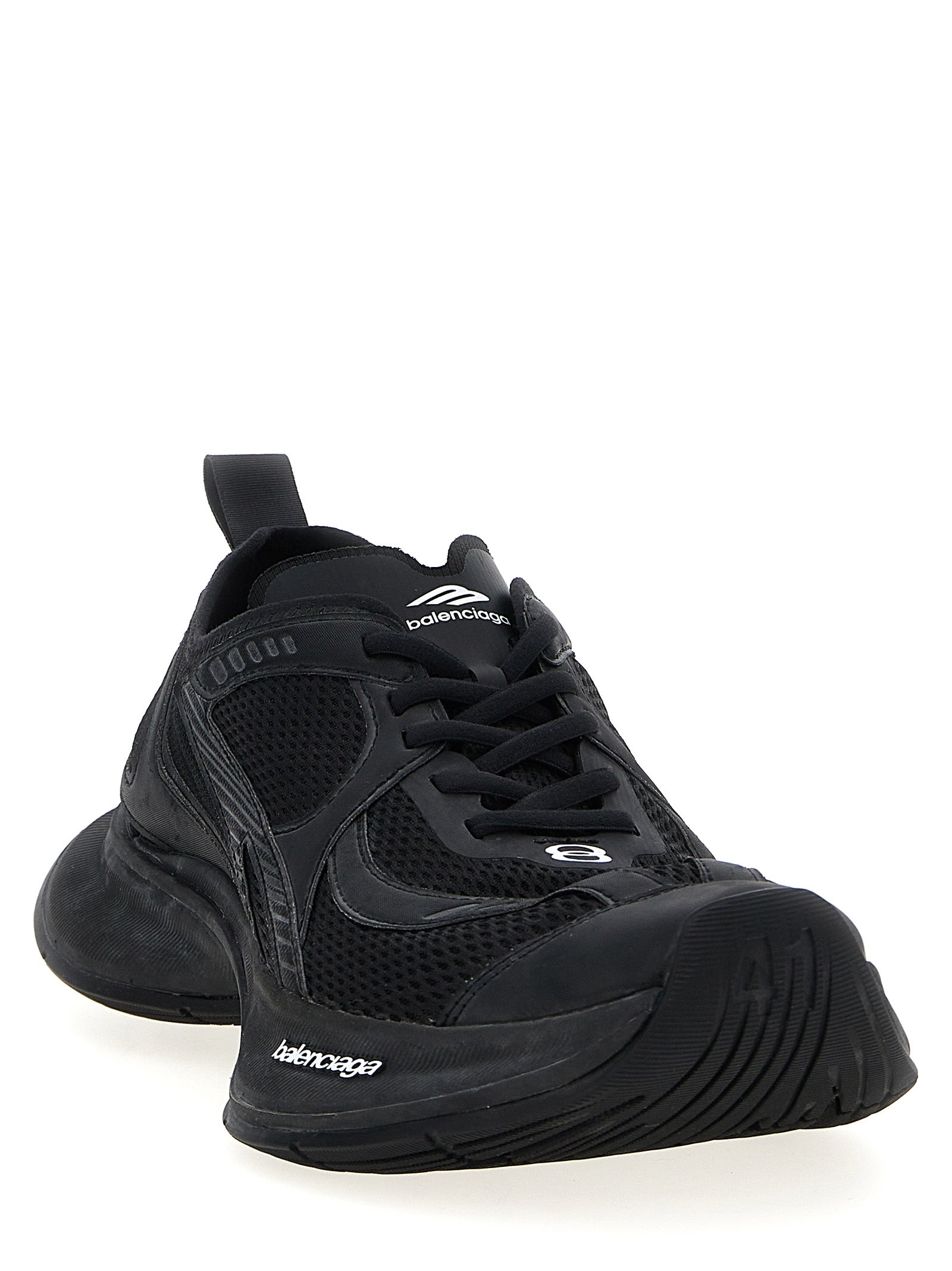 Chaussures de sport Balenciaga en polyester noir, sneakers athlétiques modernes avec semelle blanche.