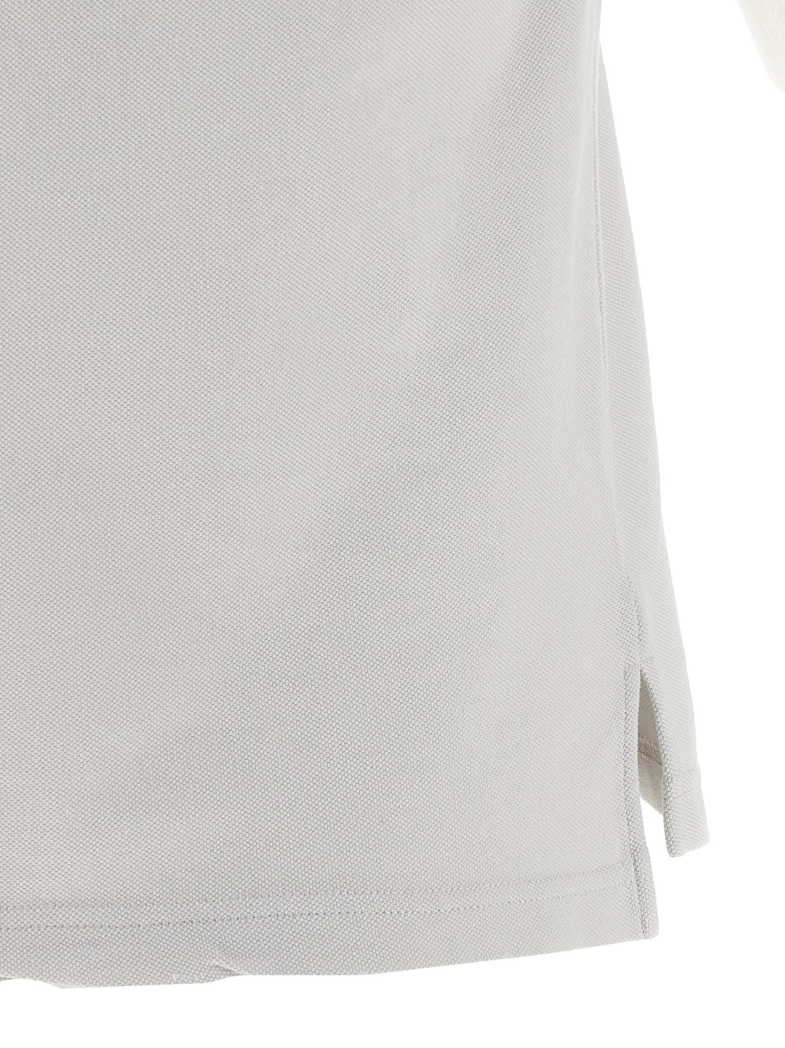 Chemise polo grise en coton de Balenciaga, vue de face, avec col et boutons visibles.