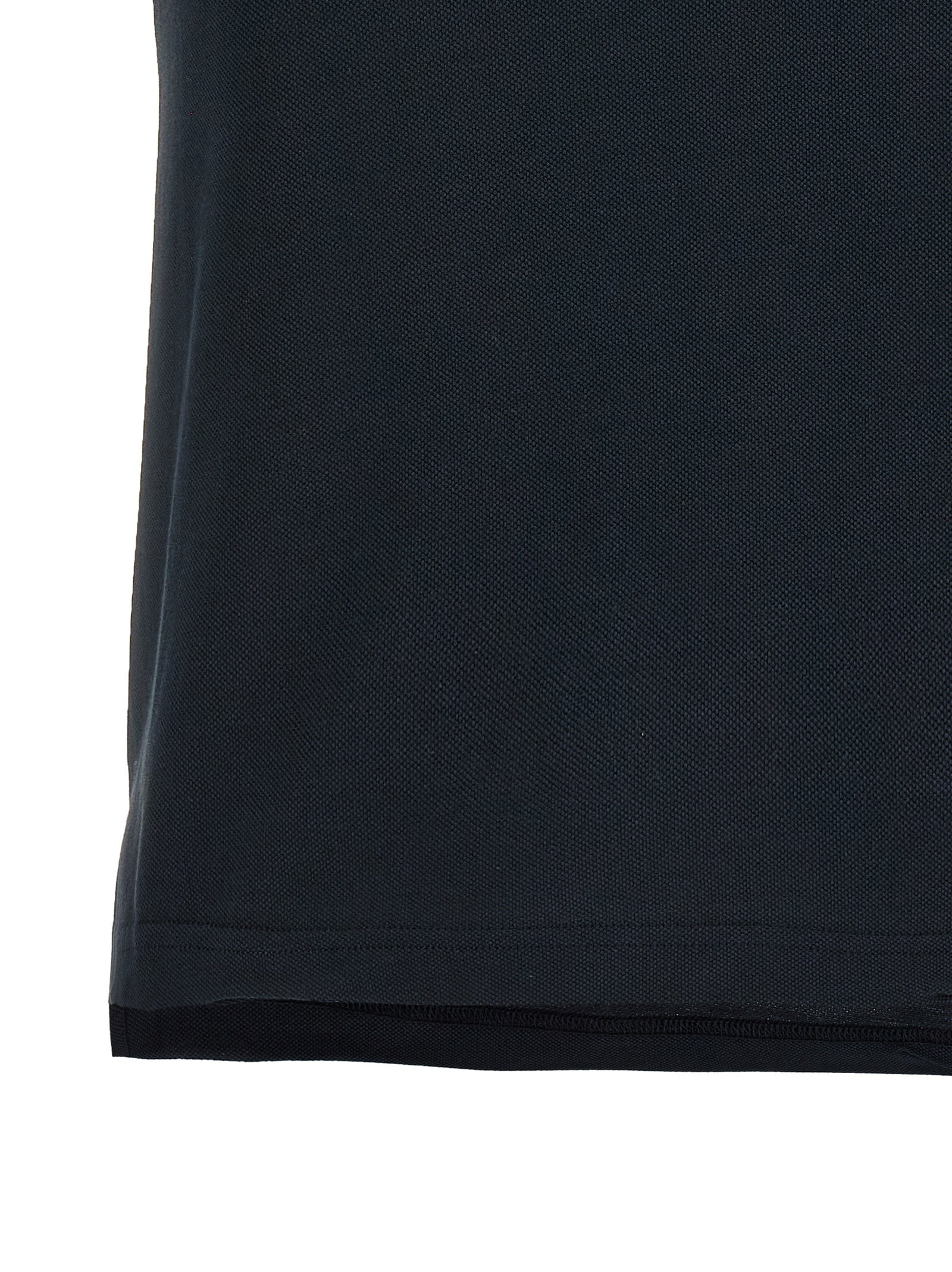 Chemise polo en coton bleu de Balenciaga, vue de face avec col et boutons visibles.