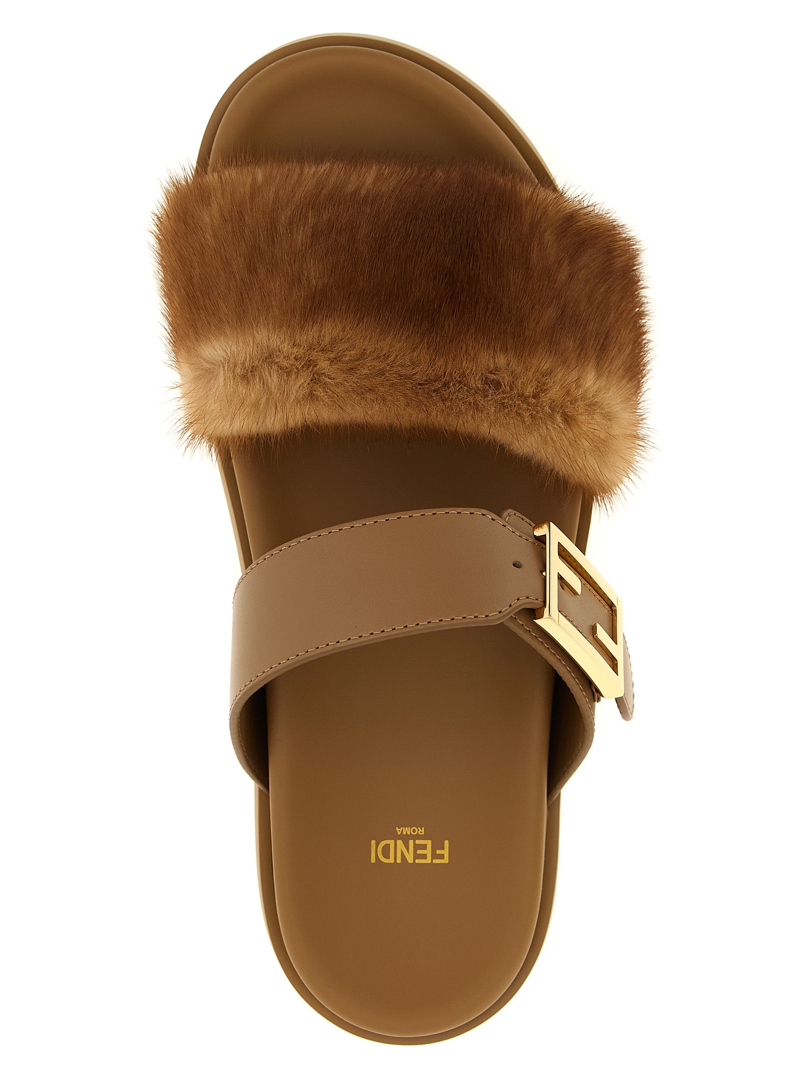 Sandales en cuir marron de Fendi, slides élégantes avec finition de haute qualité, visibles sur la photo.
