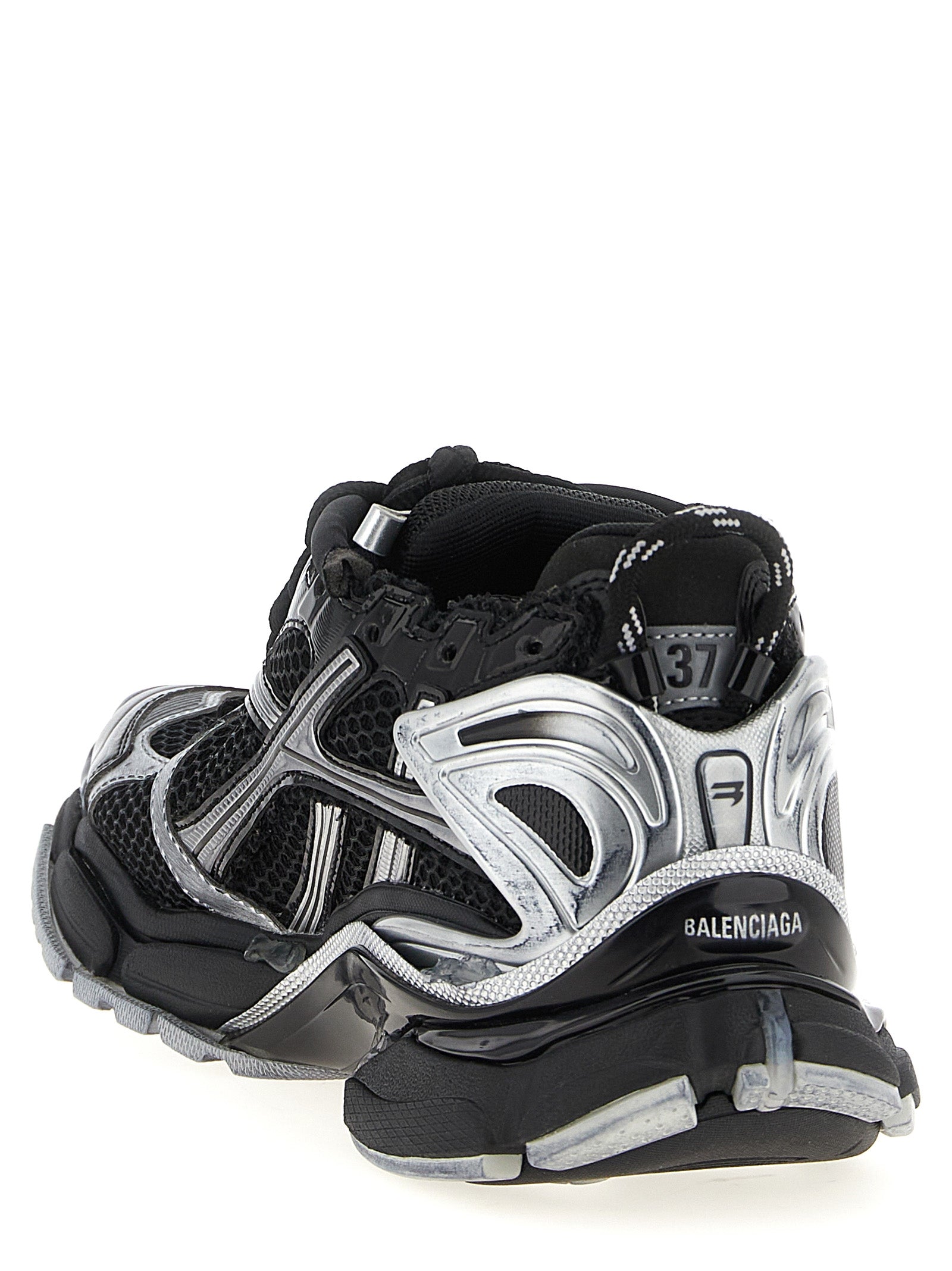Chaussures de sport Balenciaga en polyéthylène noire, sneakers athlétiques modernes et élégants, vues de face sur fond blanc.