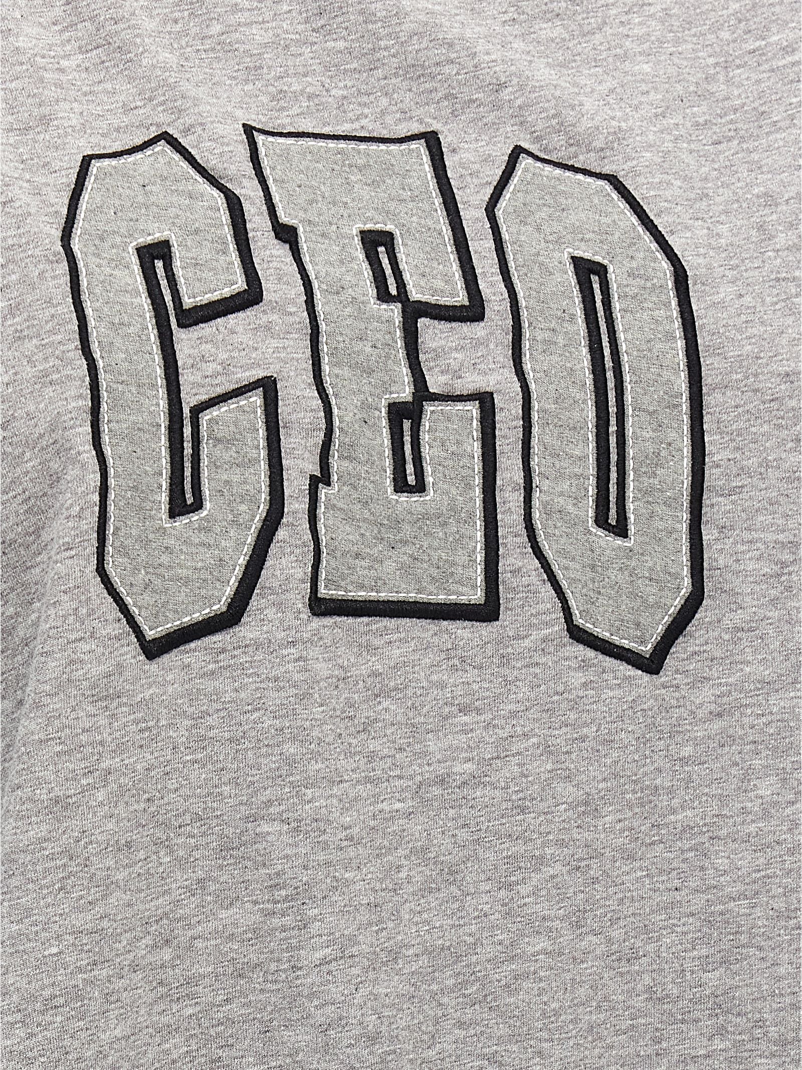 T-shirt gris en coton de la marque Balenciaga, coupe classique, visible avec col rond et logo discret sur le devant.
