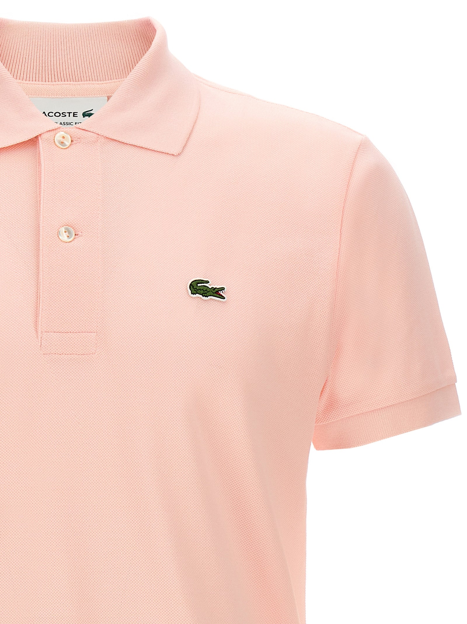 Chemise polo en coton multicolore Lacoste, manches courtes avec col classique, logo crocodile sur la poitrine.