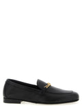 Chaussures mocassins slip-on en cuir de veau noir de la marque Versace, élégantes et confortables.