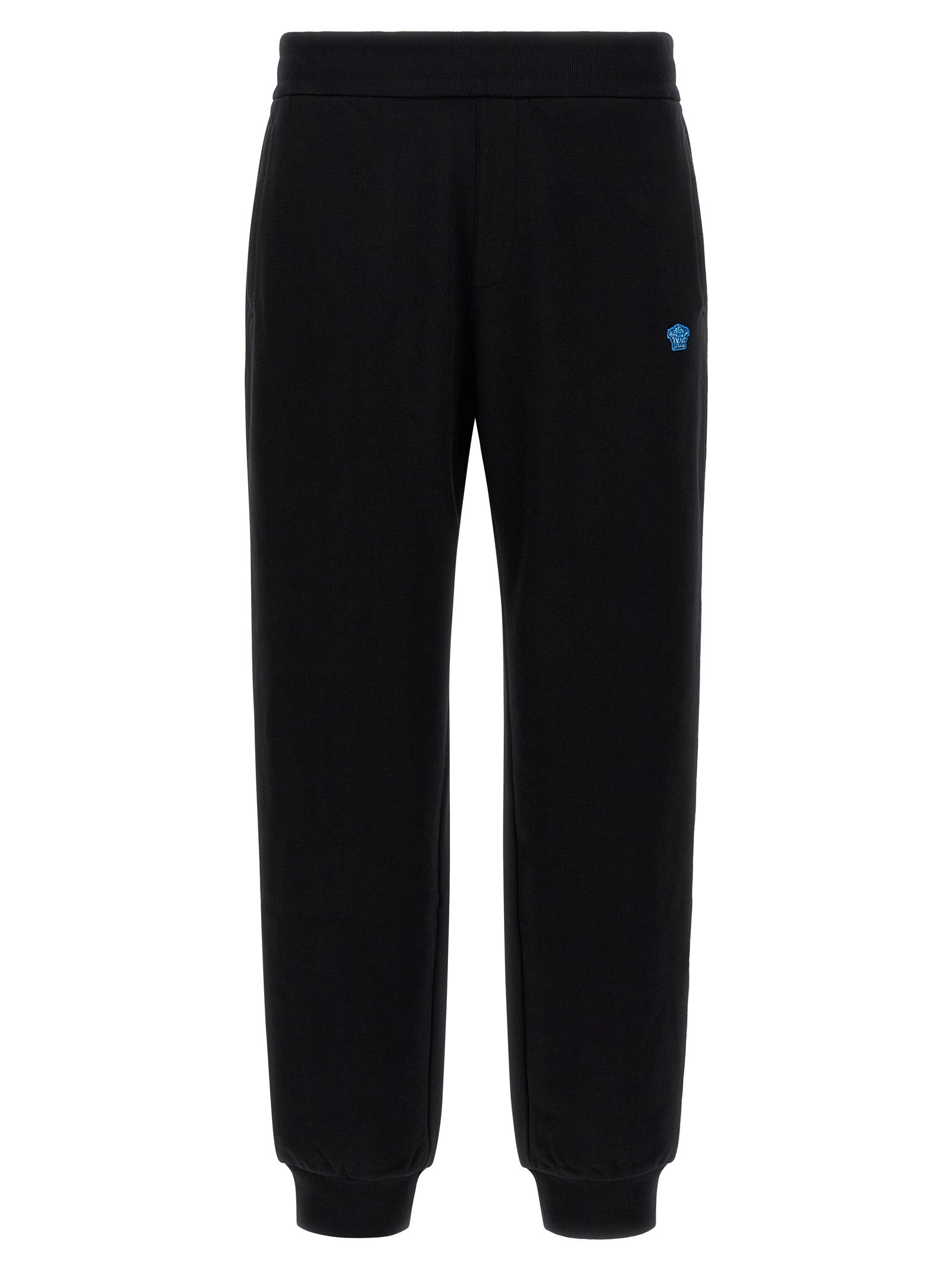 Pantalons de jogging en coton noir Versace pour la gym, avec logo distinctif et coupe décontractée, visible sur l'image.