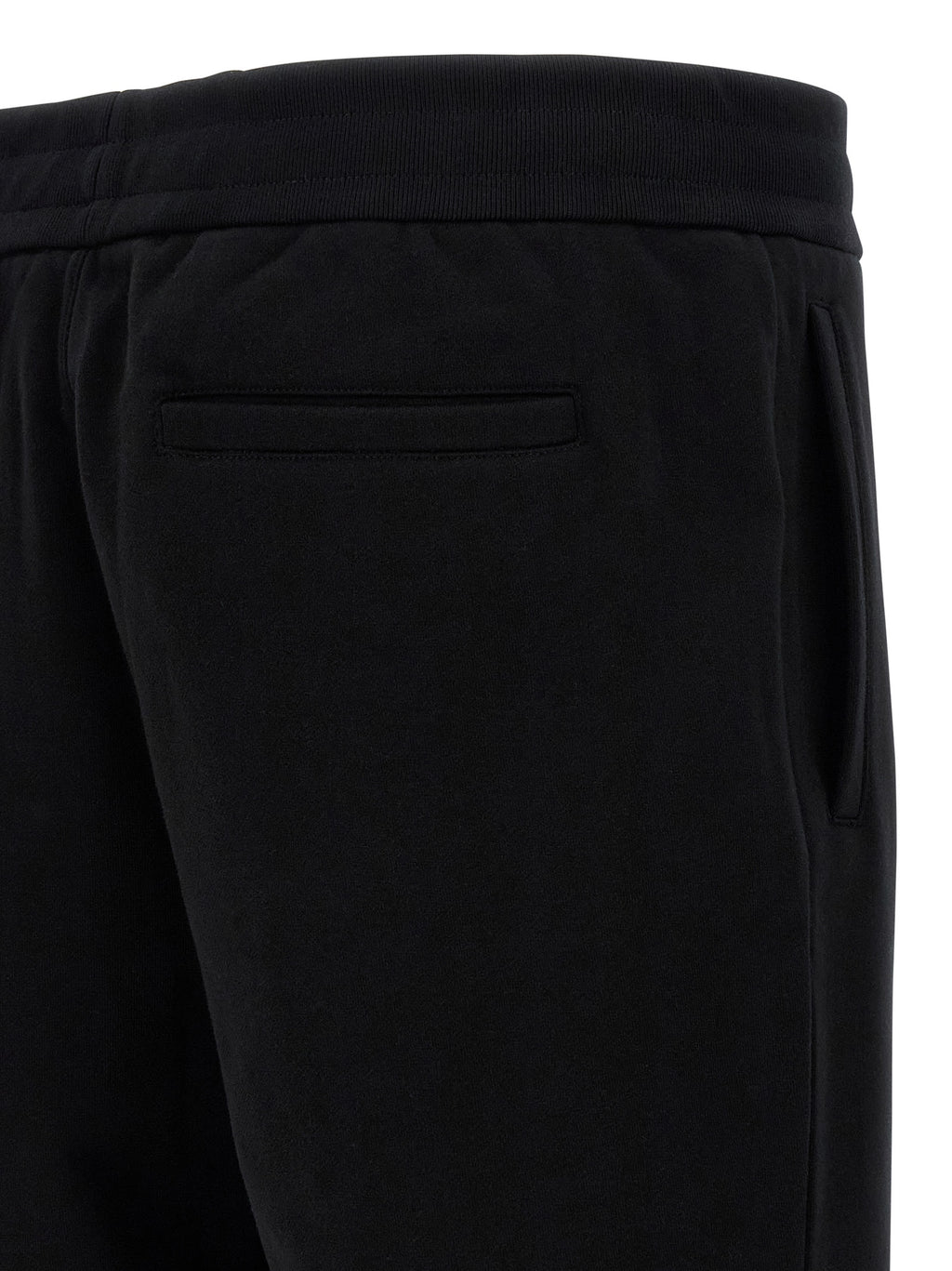 Pantalons de jogging noirs en coton Versace pour homme, style décontracté avec logo emblématique, confort pour la détente et l'entraînement.