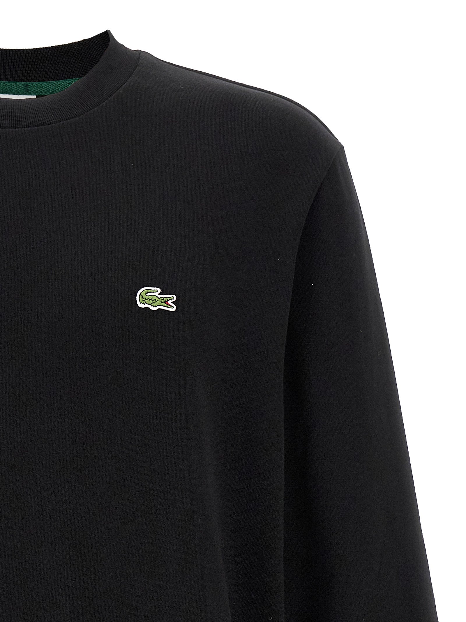 Sweat-shirt en coton noir de marque Lacoste, à col rond et logo crocodile sur la poitrine, pour homme.