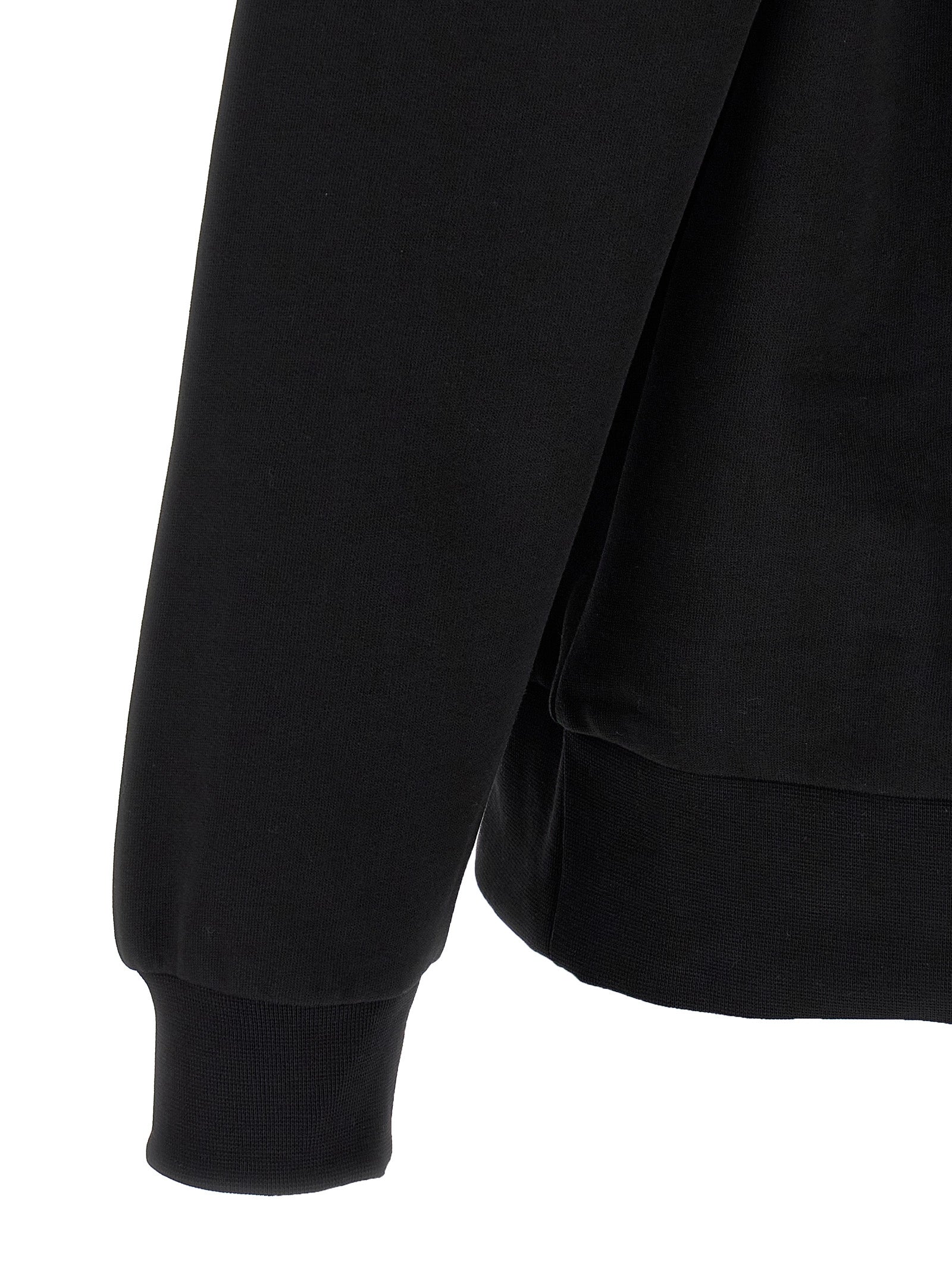 Sweat-shirt noir en coton de la marque Lacoste, avec logo crocodile visible sur la poitrine.