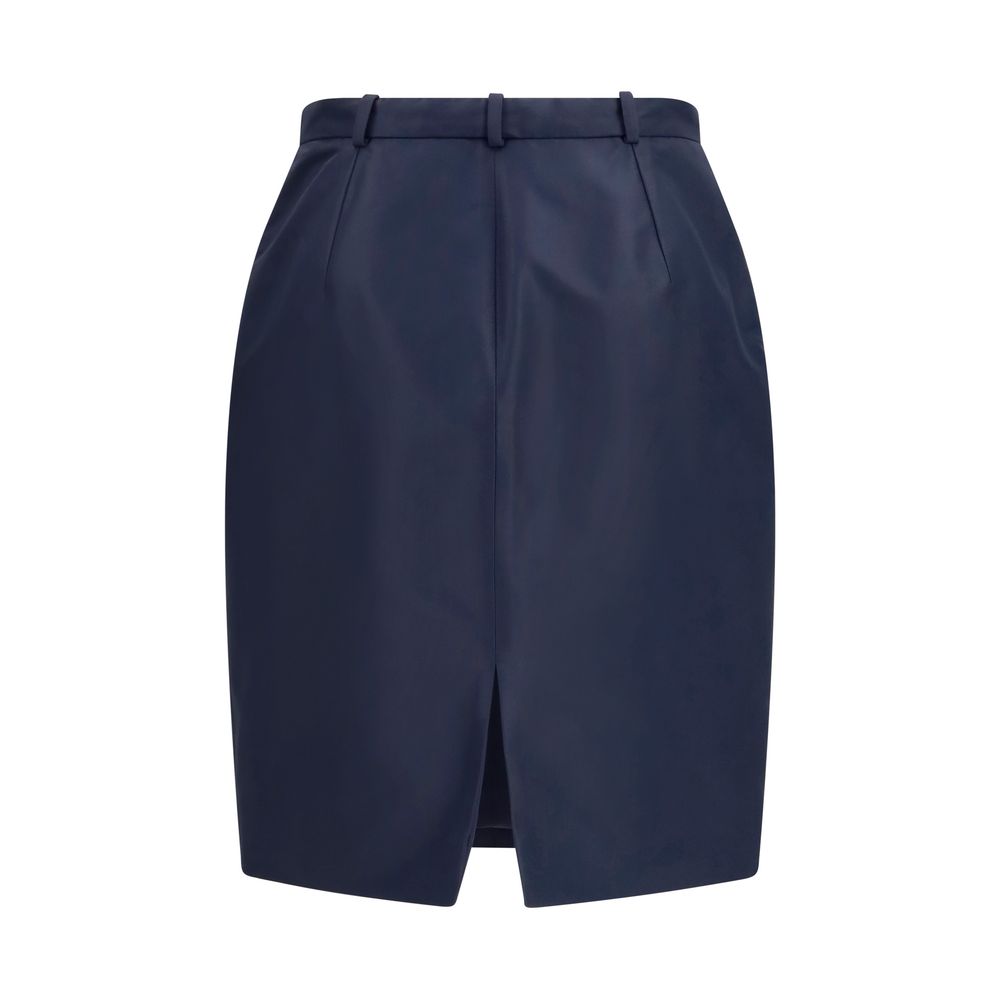 Jupe en soie bleue Gucci, élégante et fluide, avec coupe flatteuse et détail sophistiqué visible sur l'image.