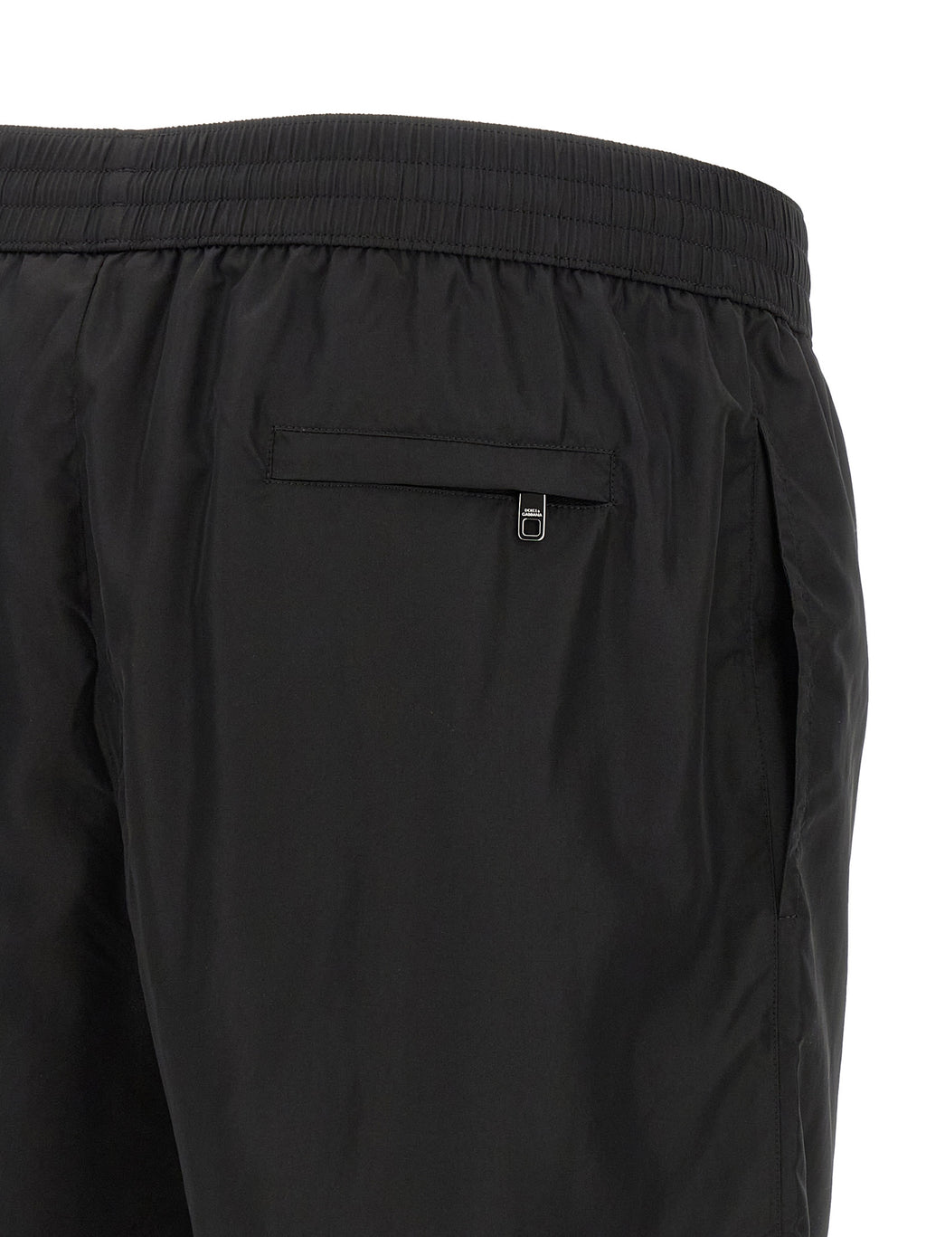 Shorts de bain noirs en polyamide de Dolce & Gabbana, style élégant et moderne, tissu léger et confortable visible dans l'image.
