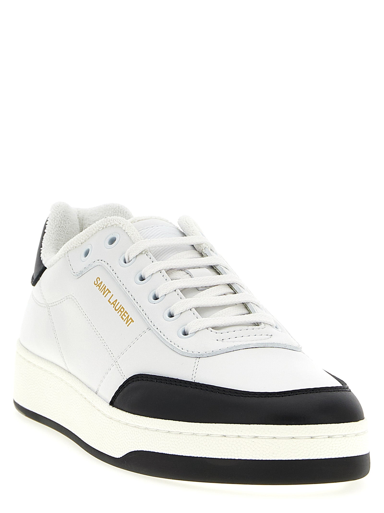Sneakers basses Saint Laurent en cuir bicolore avec semelle blanche, style élégant et moderne pour homme.